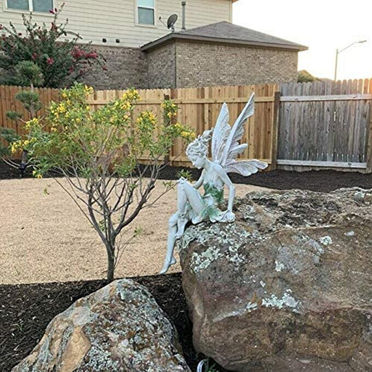 Kalsten | Statue of sitting fairy in the garden