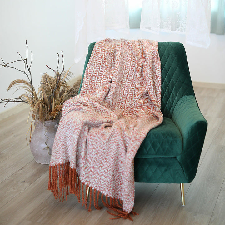 Coarsely woven throw blanket with herringbone jacquard and long fringes