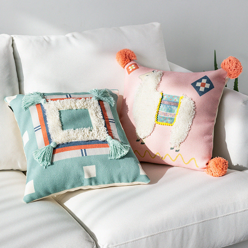 Square cushion cover with 3D alpaca appliqué, bouclé patch and pom-pom corners Kalsten