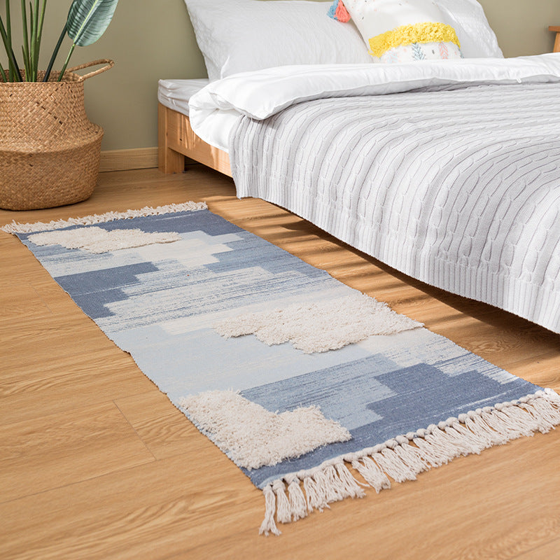 Modern woven living room rug with abstract structure and tufted high-pile accents Kalsten