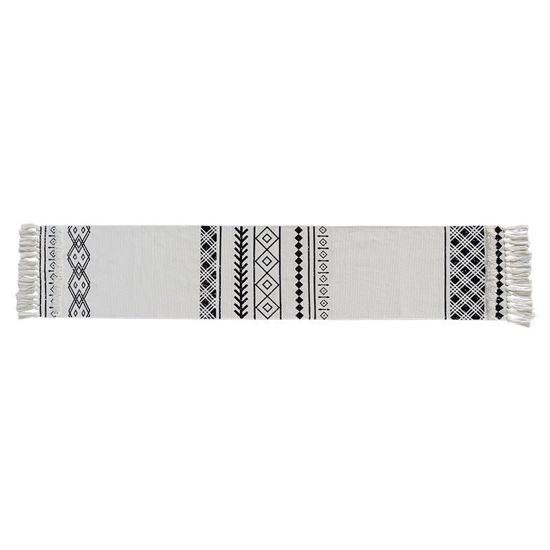 Boho table runner made of a cotton mix with embroidered ethnic motif and fringes