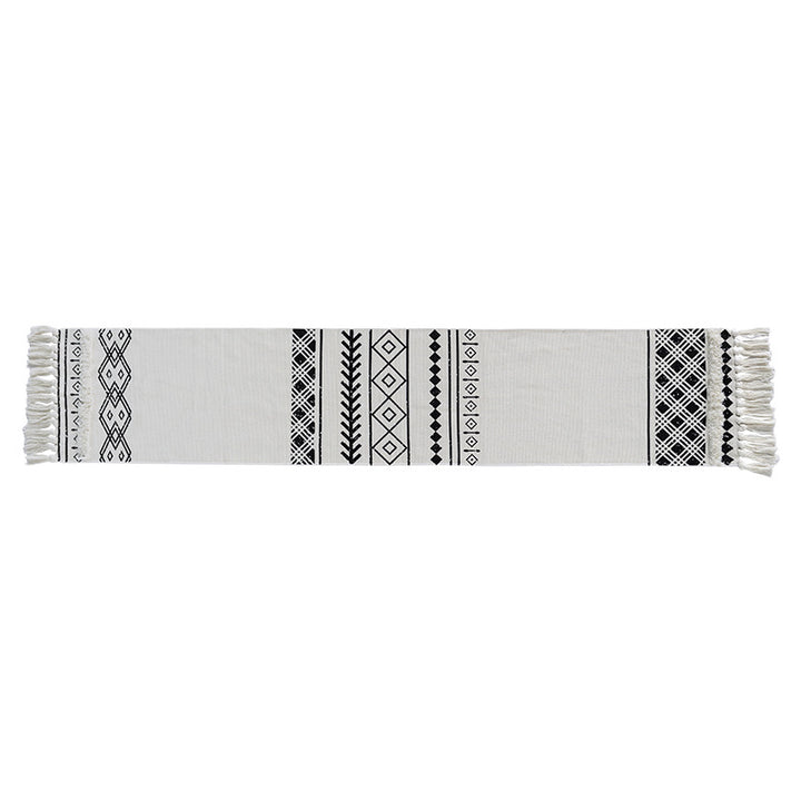 Boho table runner made of a cotton mix with embroidered ethnic motif and fringes