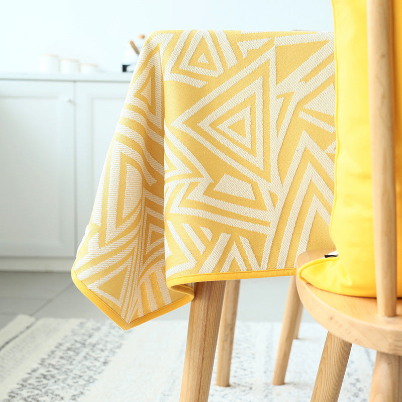 Woven jacquard tablecloth with geometric triangle pattern and easy-care cotton blend