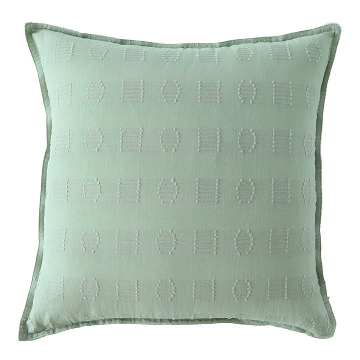 Square decorative cushion cover with subtle tufted geometric relief and piping