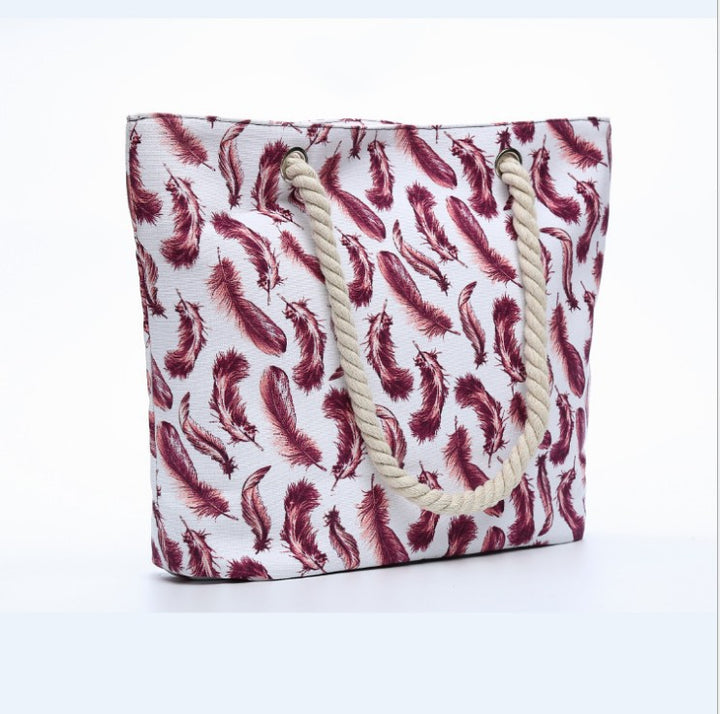Beach bag with playful feather pattern Kalsten