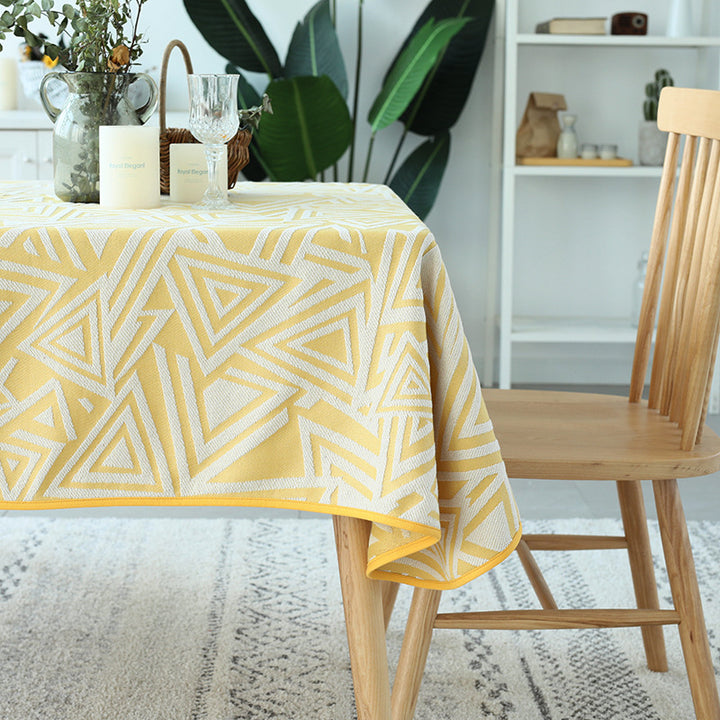 Woven jacquard tablecloth with geometric triangle pattern and easy-care cotton blend