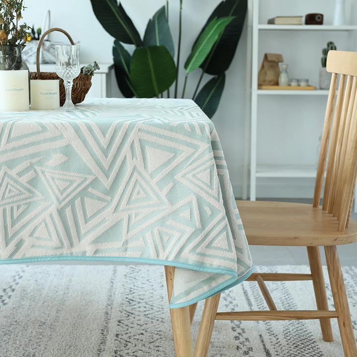 Woven jacquard tablecloth with geometric triangle pattern and easy-care cotton blend