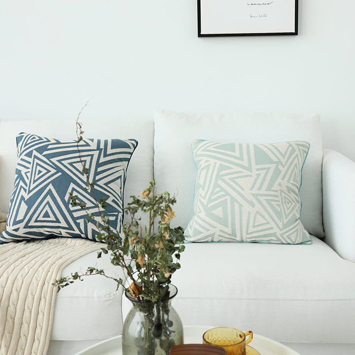Square cushion cover with double-sided jacquard triangle motif and piping