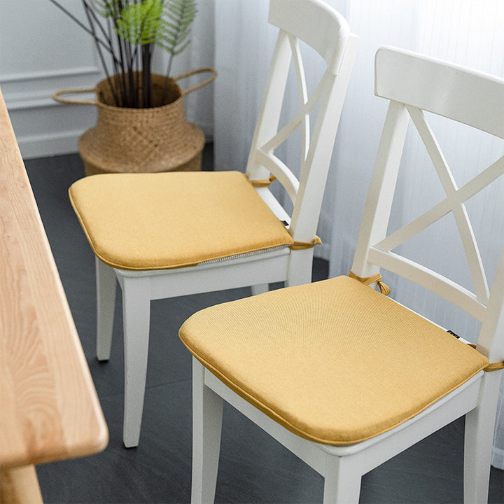 Padded chair cushion with ties in linen look