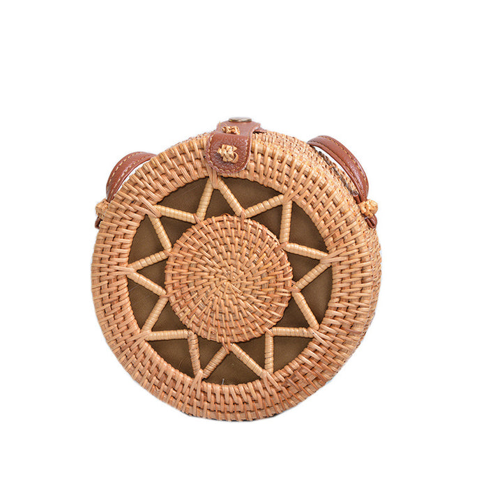 Elegant round handbag made of woven rattan Kalsten