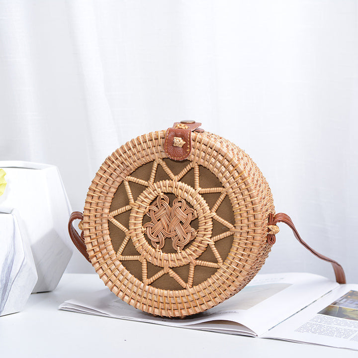 Elegant round handbag made of woven rattan Kalsten
