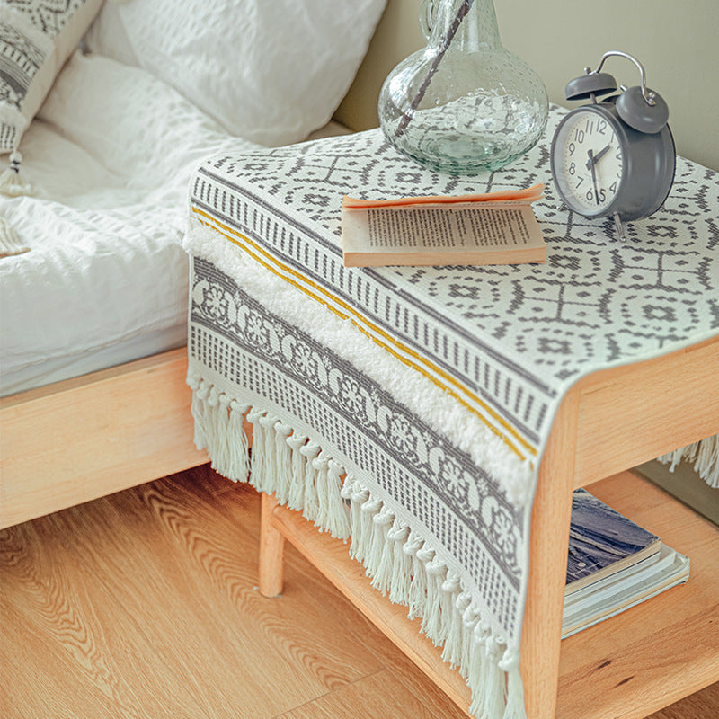Handwoven cotton runner in Scandi-Boho style with fringes and geometric diamond jacquard Kalsten