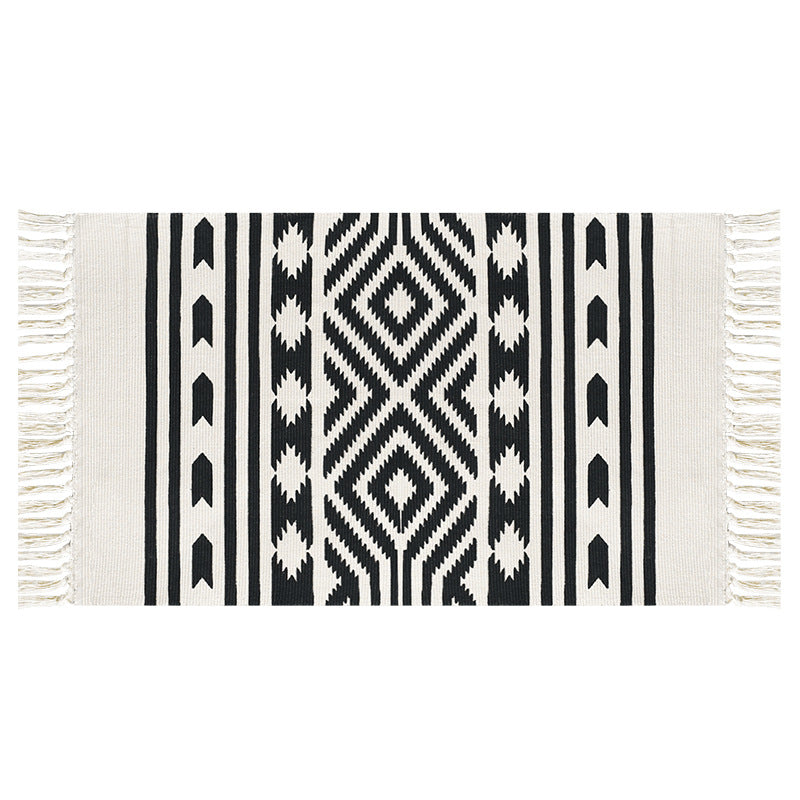 Woven decorative runner made of cotton blend with ethnic diamond pattern and fringes
