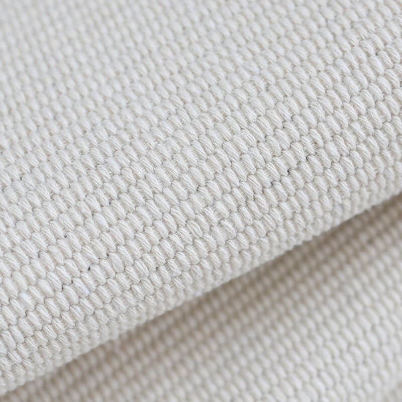 Woven decorative runner made of cotton blend with ethnic diamond pattern and fringes