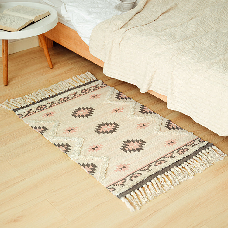 Flat woven runner in ethnic medallion style made of cotton-linen blend with hand-knotted fringes