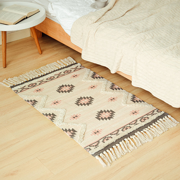 Flat woven runner in ethnic medallion style made of cotton-linen blend with hand-knotted fringes