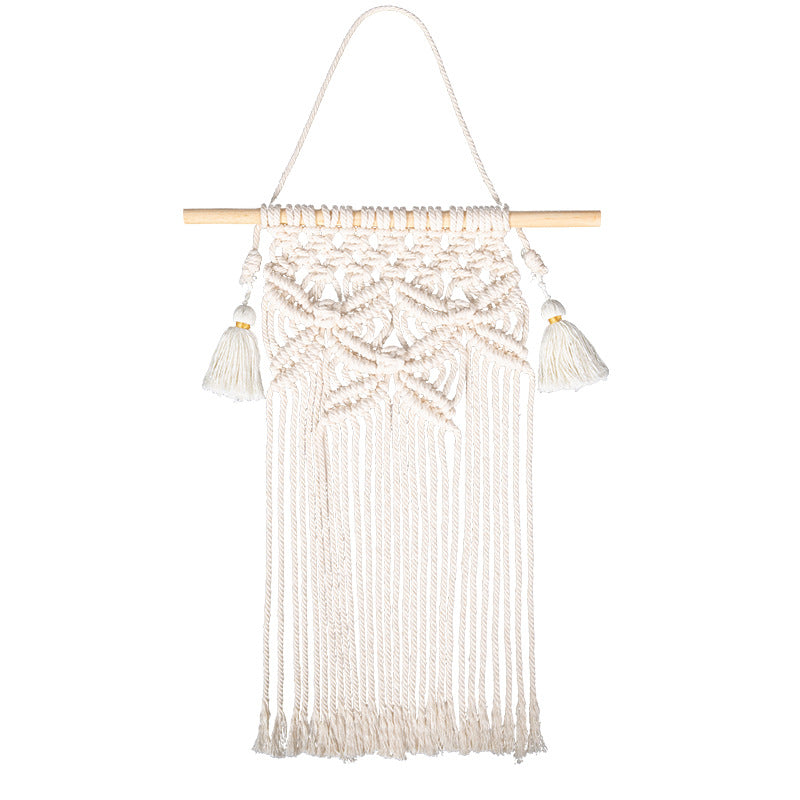 Handmade macrame wall hanging with long tassels and wooden rod