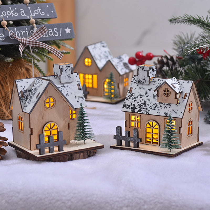 Illuminated wooden Christmas house with LED