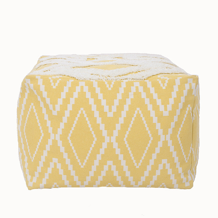 Padded footstool pouf with plush top and woven diamond pattern