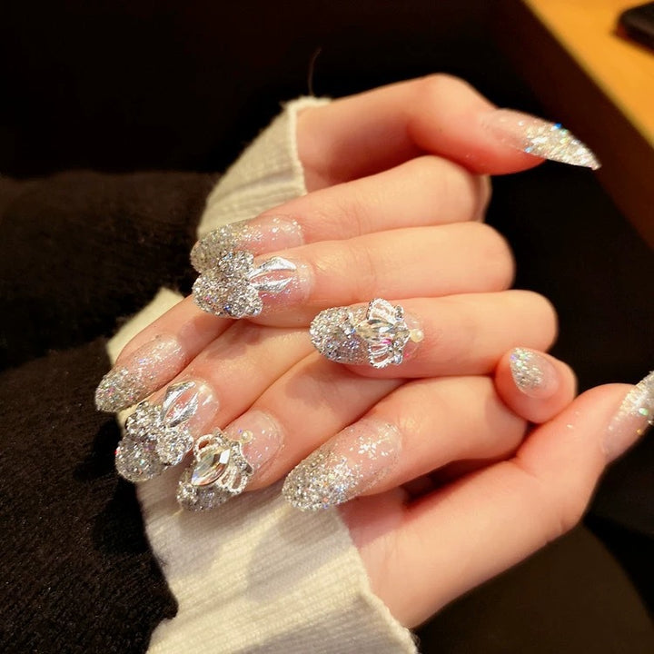 Nail art with sparkling rhinestone and glitter accents Kalsten