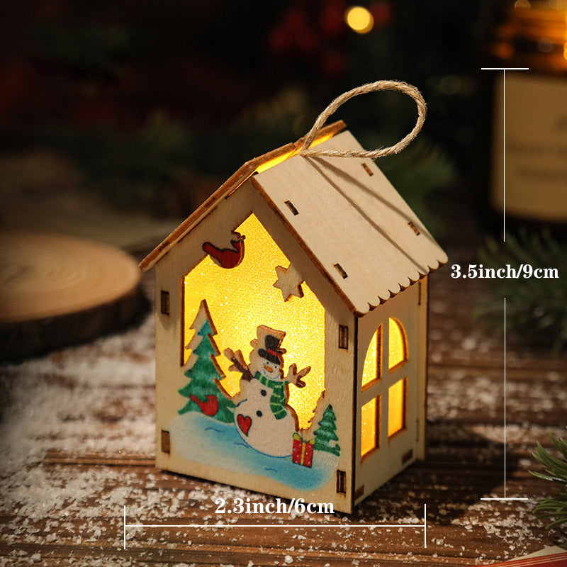 Illuminated wooden house for Christmas decoration