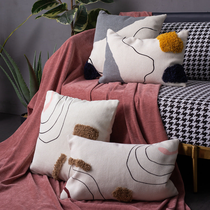Woven decorative cushion cover in an abstract-minimalist Scandi look with hand-tufted applications