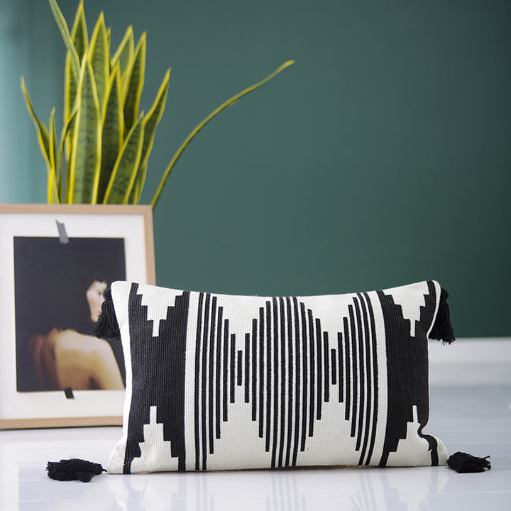 Rectangular woven cushion cover in ethnic jacquard with four tassels and concealed zipper