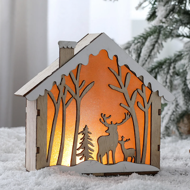 Illuminated wooden Christmas house in Scandinavian style