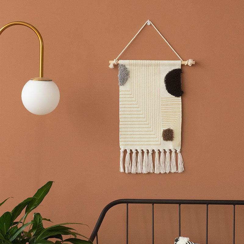 Decorative wall tapestry made of cotton with geometric ethnic pattern and tassels