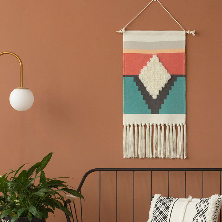 Decorative wall tapestry made of cotton with geometric ethnic pattern and tassels
