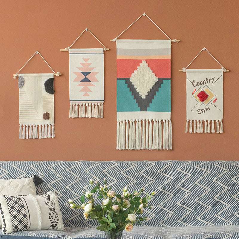 Decorative wall tapestry made of cotton with geometric ethnic pattern and tassels
