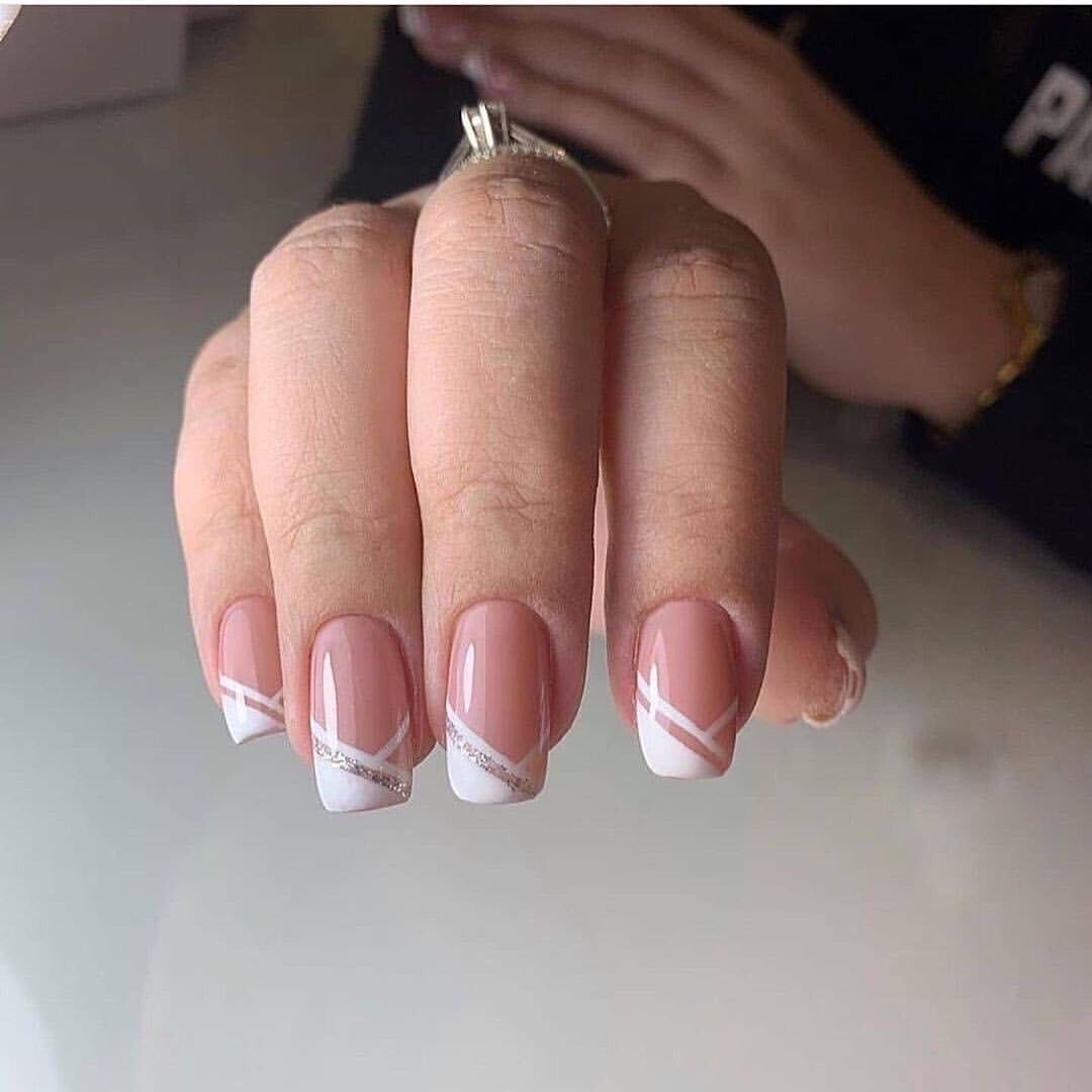 Artful nail design with elegant French tip and glitter accents Kalsten