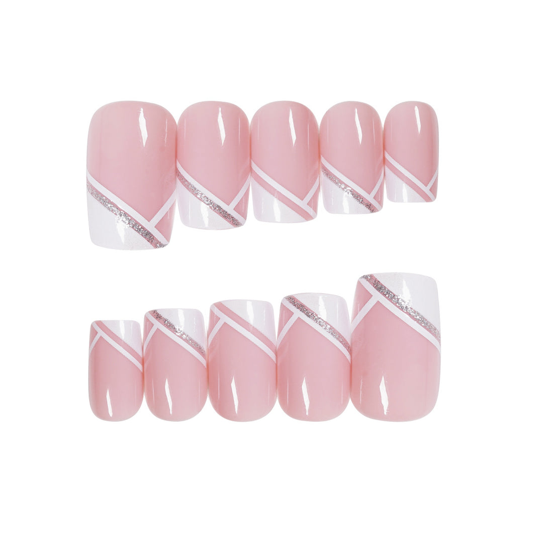 Artful nail design with elegant French tip and glitter accents Kalsten