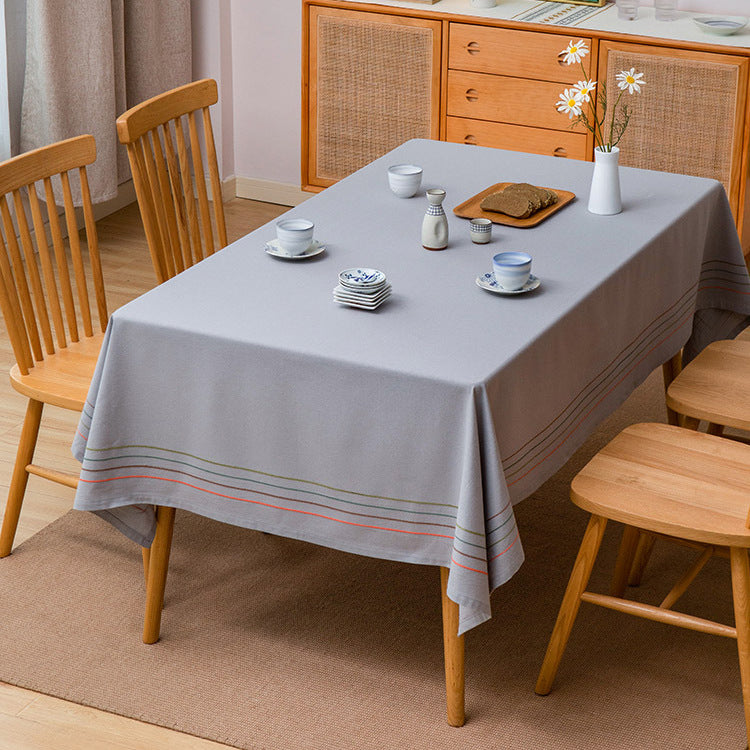 Rectangular tablecloth made of cotton-linen blend with fine embroidered stripe look and decorative tassels