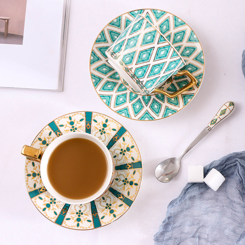 Elegant porcelain coffee cup set with saucers, spoons and delicate ornamental decoration
