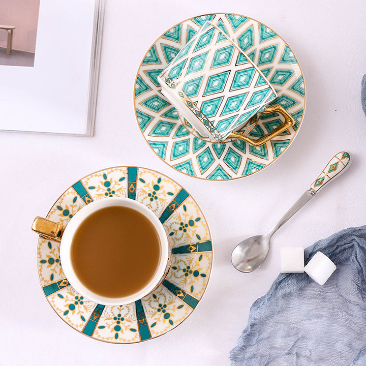 Elegant porcelain coffee cup set with saucers, spoons and delicate ornamental decoration