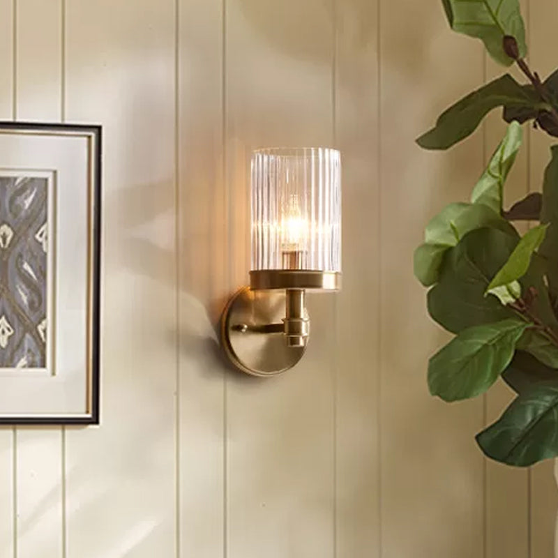 1-Light Wall Mounted Lamp Traditional Cylinder Transparent Glass Sconce Light in Brown/Gold over Bed | Kalsten