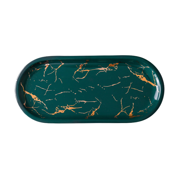 Oval serving tray made of melamine with glossy marble look and raised edge