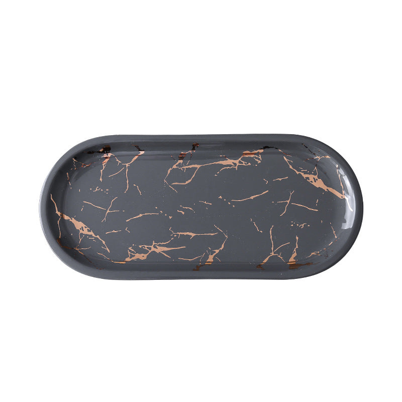 Oval serving tray made of melamine with glossy marble look and raised edge