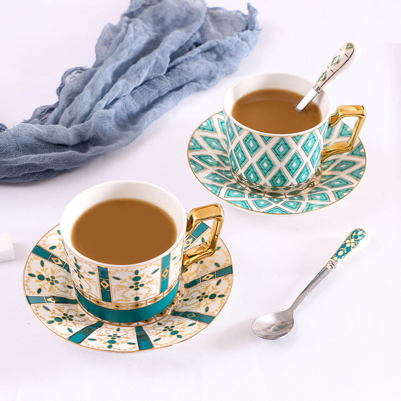 Elegant porcelain coffee cup set with saucers, spoons and delicate ornamental decoration