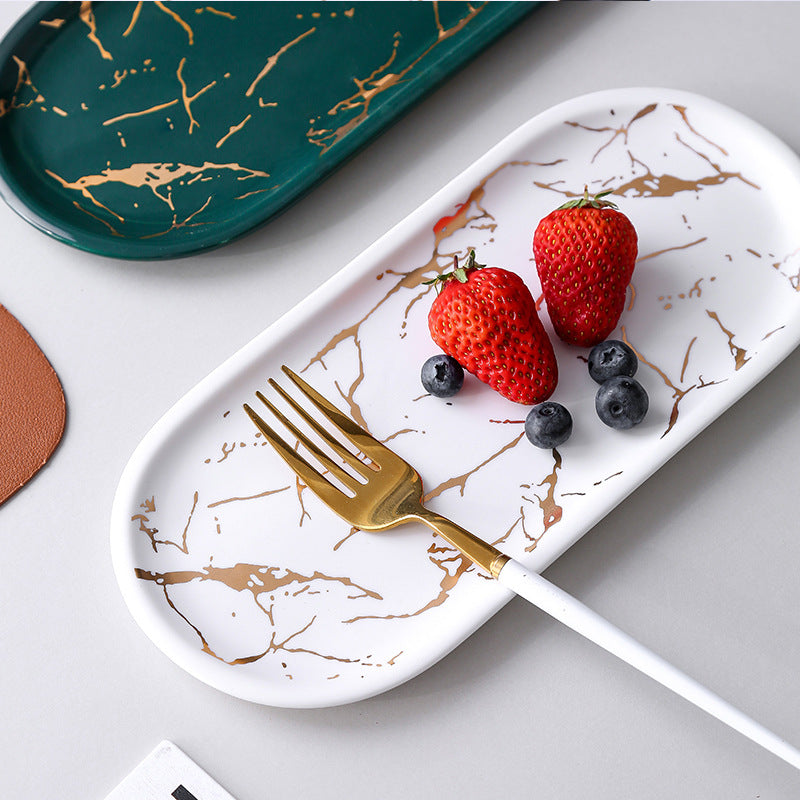 Oval serving tray made of melamine with glossy marble look and raised edge
