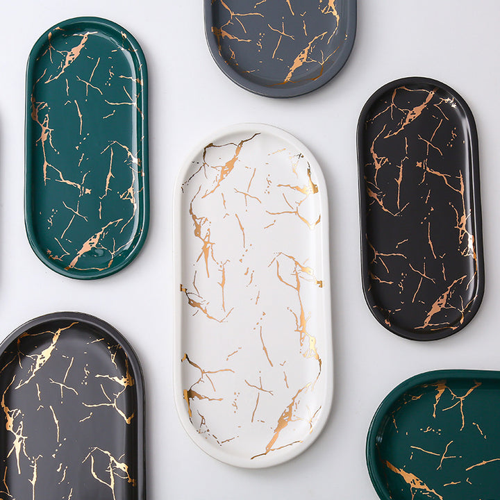 Oval serving tray made of melamine with glossy marble look and raised edge