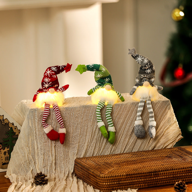 Illuminated gnome figure, sitting, with knit hat