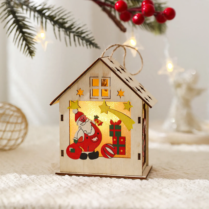 Illuminated wooden house as Christmas decoration