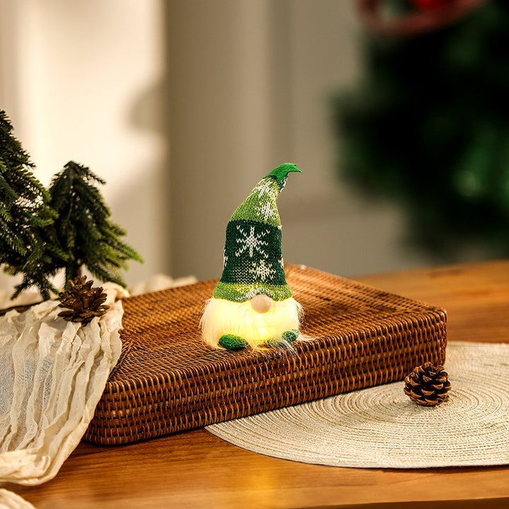 Illuminated gnome figure, sitting, with knit hat