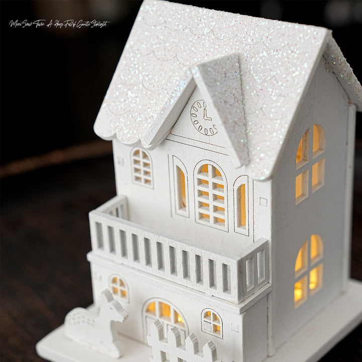 Illuminated wooden house for Christmas decoration