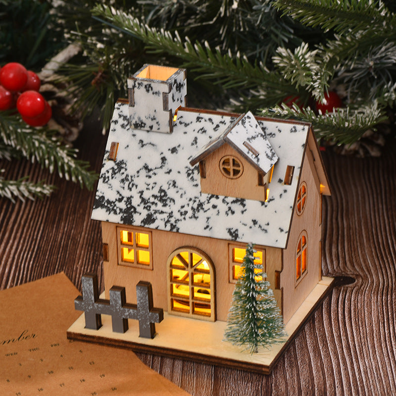 Illuminated wooden Christmas house with LED