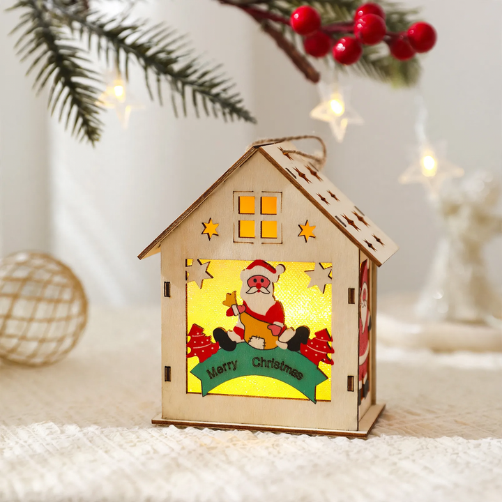 Illuminated wooden house as Christmas decoration