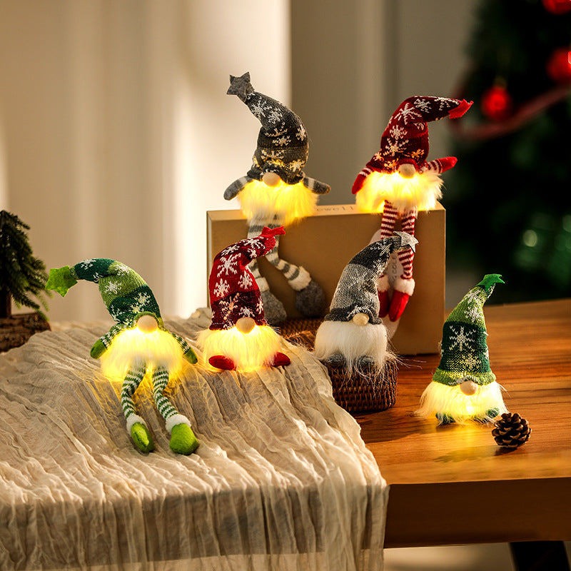 Illuminated gnome figure, sitting, with knit hat