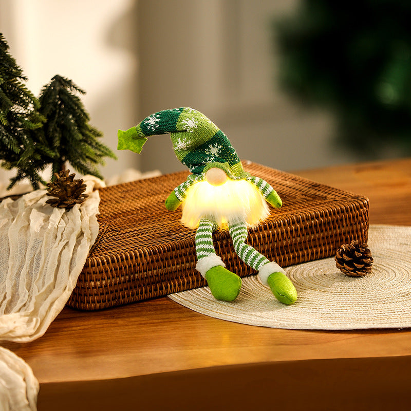 Illuminated gnome figure, sitting, with knit hat